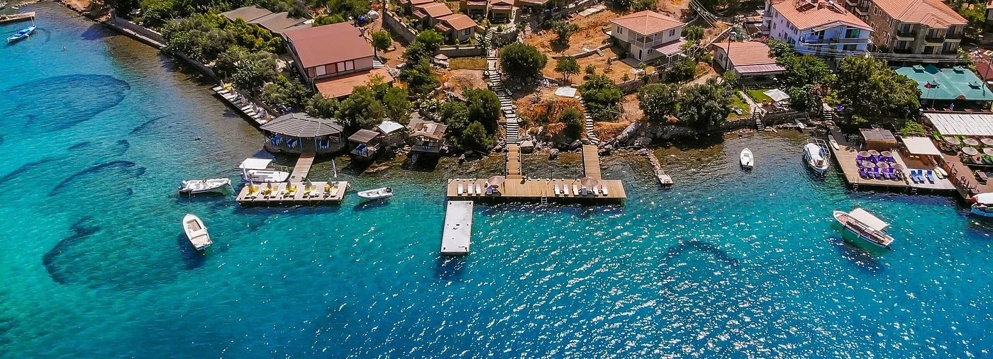Aerial view of a waterfront hotel and jetties in Bozburun