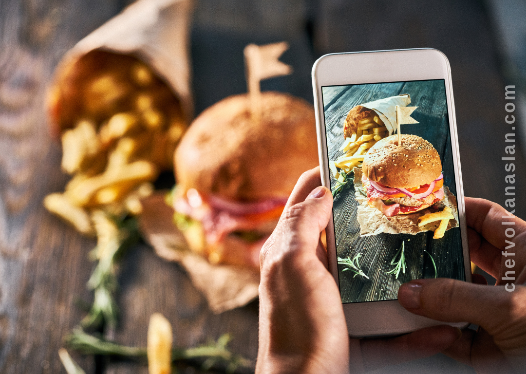 Content creator taking food photos in a restaurant
